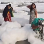 Woman Washes Hair in Toxic Foam of Yamuna River